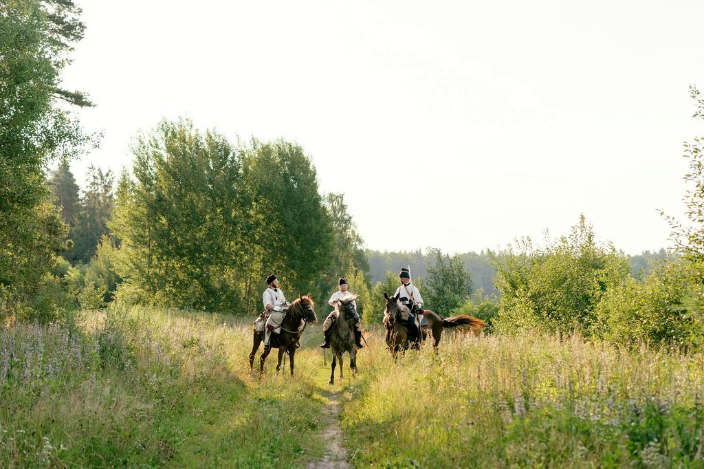 Guide leading a small group through scenic terrain